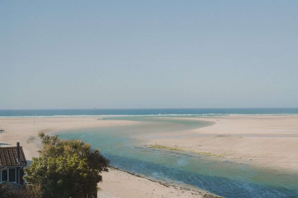 Aerial Photo of a Beach House with beach going out to sea
